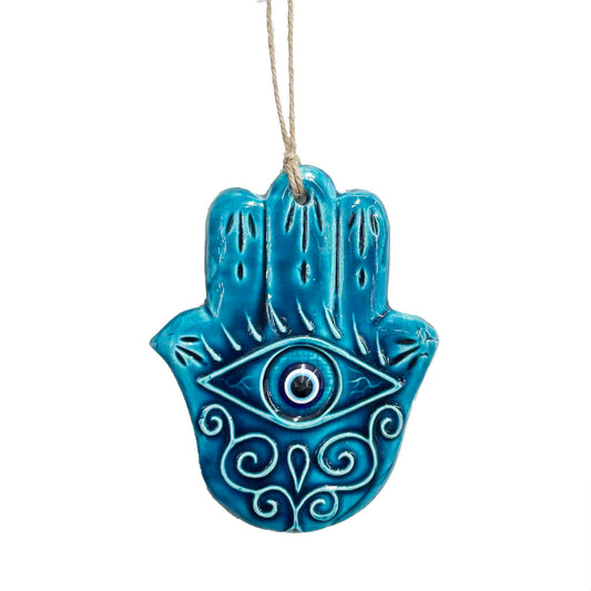 Amuleto ojo turco en mano de Fátima de pared en color azul.